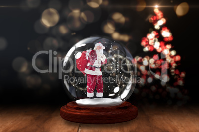 Santa asking for quiet in snow globe