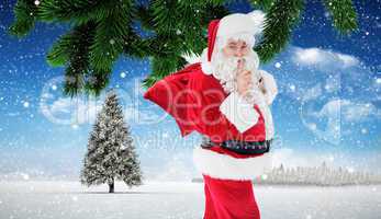 Composite image of santa keeping a secret and holding his sack