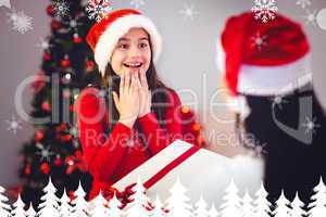 Composite image of mother giving her daughter a christmas presen