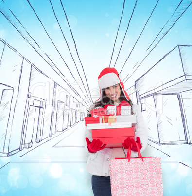 Composite image of brunette in winter clothes holding many gifts