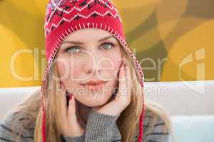 Composite image of woman wearing hat