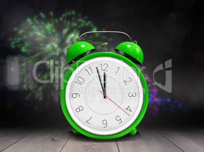 Composite image of alarm clock counting down to twelve