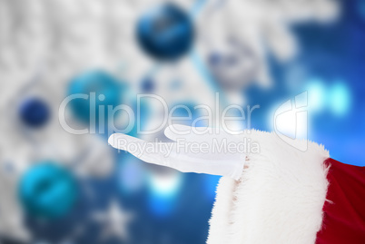 Composite image of santa claus with hand out