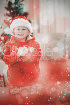 Composite image of festive little boy smiling at camera