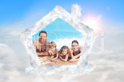 Composite image of happy family beside the swimming pool