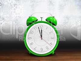 Composite image of alarm clock counting down to twelve