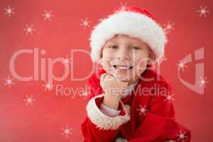 Composite image of cute little boy in santa costume