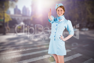 Composite image of pretty air hostess with hand on hip