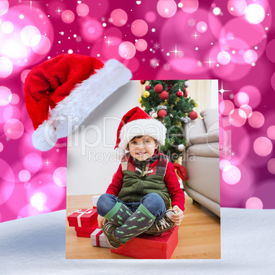 Composite image of cute festive little boy smiling at camera