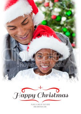 Composite image of happy little girl playing with a christmas gi