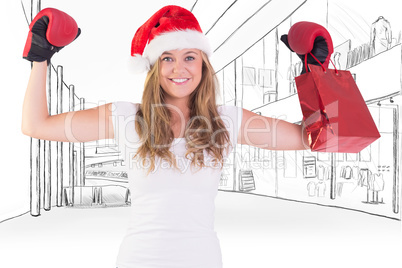 Composite image of festive blonde with boxing gloves and shoppin