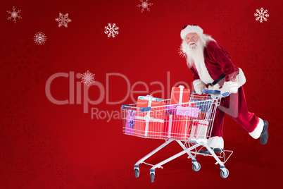 Composite image of santa rides on a shopping cart