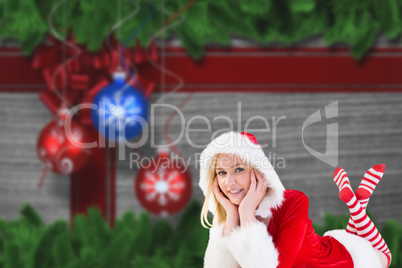 Composite image of festive blonde smiling at camera