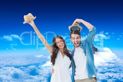 Composite image of happy hipster couple smiling at camera and ch
