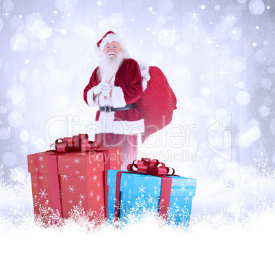 Composite image of santa carries his red bag