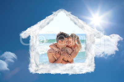 Composite image of happy lovers at the beach