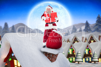 Composite image of santa on cottage roof