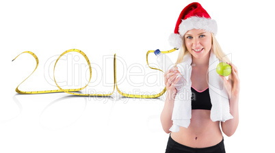 Composite image of festive fit blonde smiling at camera