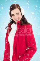 Composite image of smiling brunette posing with winter wear