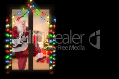 Composite image of santa claus has fun with a guitar