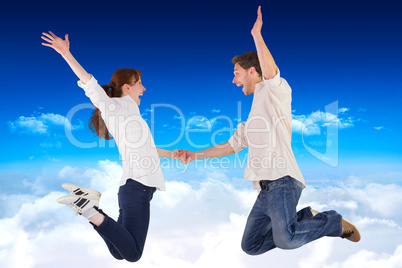 Composite image of couple jumping and holding hands