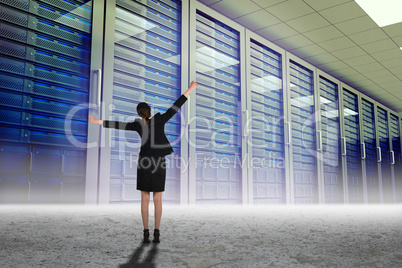 Composite image of excited businesswoman cheering