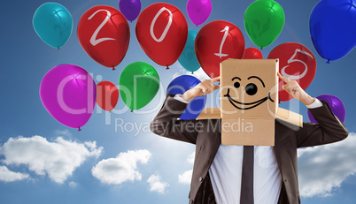 Composite image of anonymous businessman pointing to box