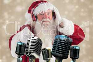 Composite image of santa is listening some music