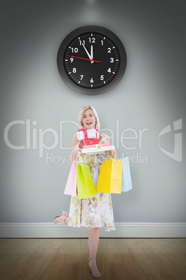 Composite image of elegant blonde with shopping bags and gifts