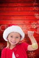 Composite image of cute little girl wearing santa hat holding ba