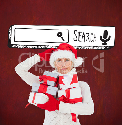 Festive woman in santa hat holding gifts