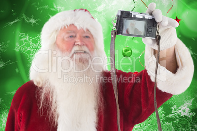 Composite image of santa claus makes a selfie