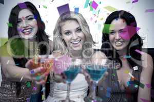 Composite image of pretty friends drinking cocktails together