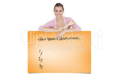 Composite image of maid holding spoon as she leans on blank bill