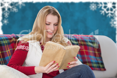 Composite image of woman reading a book