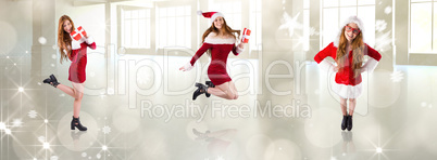 Composite image of festive redhead holding a gift