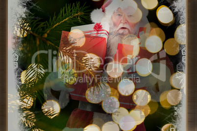 Composite image of santa carries a few presents