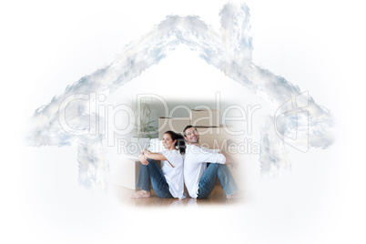 Composite image of glowing couple sitting on the floor