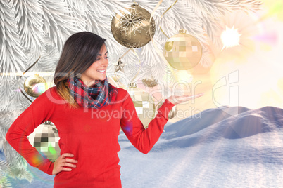 Composite image of beautiful brunette with hand out