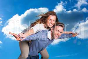 Composite image of smiling young man carrying woman