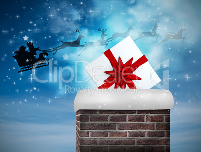 Composite image of santa flying his sleigh