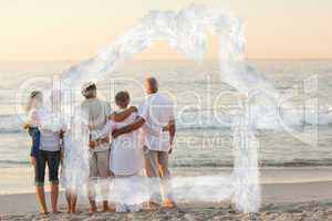 Composite image of beautiful family at the beach