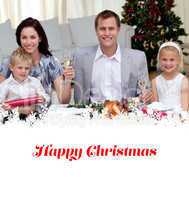 Composite image of parents toasting with champagne in christmas