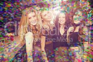 Composite image of stylish friends smiling at camera together