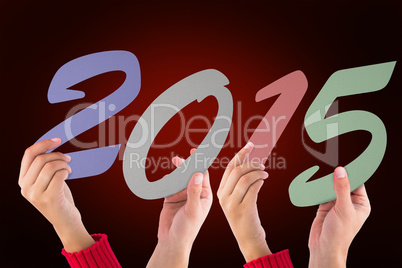 Composite image of hands holding poster