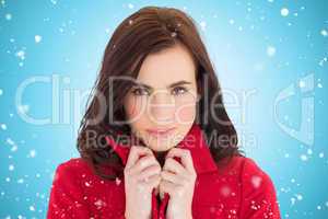Composite image of portrait of a pretty brunette in red coat