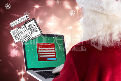 Composite image of santa claus uses a laptop