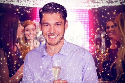 Composite image of man toasting with champagne