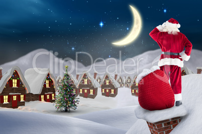 Composite image of santa on cottage roof