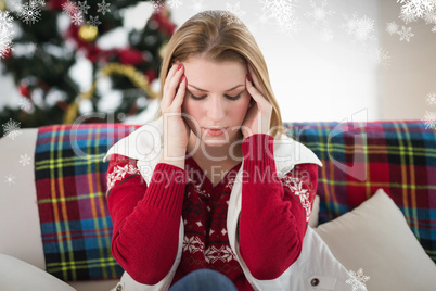 Composite image of pretty blonde woman having a headache on the